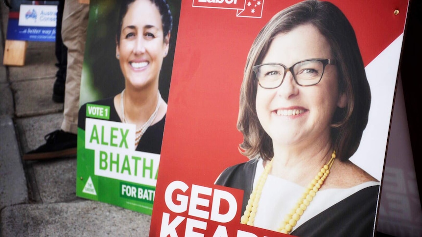 One sign for Labor candidate Ged Kearney next to a sign for Greens candidate Alex Bhathal