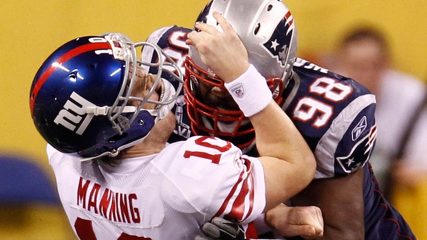Manning gets crunched by the Patriots
