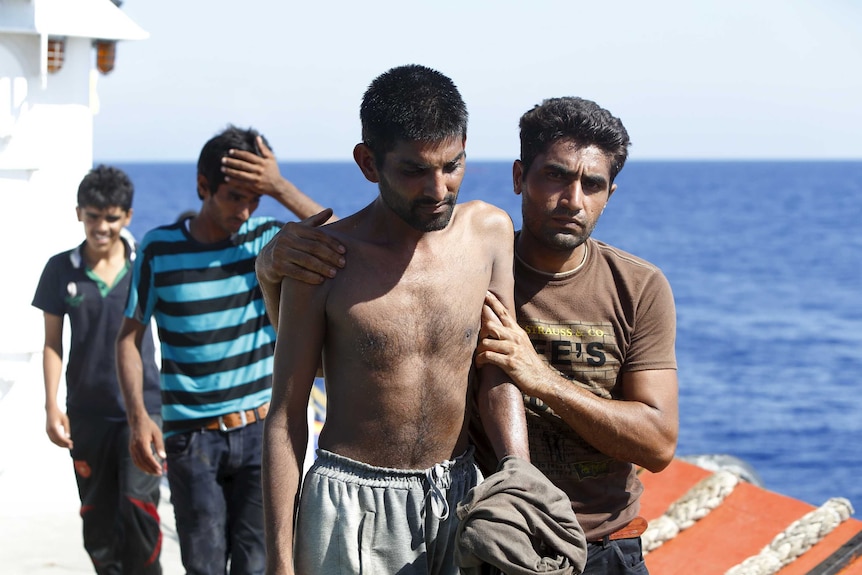 Migrants after being rescued