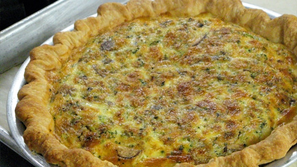 Generic photo of a quiche on a silver tray