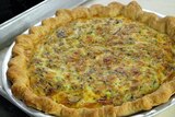 Generic photo of a quiche on a silver tray
