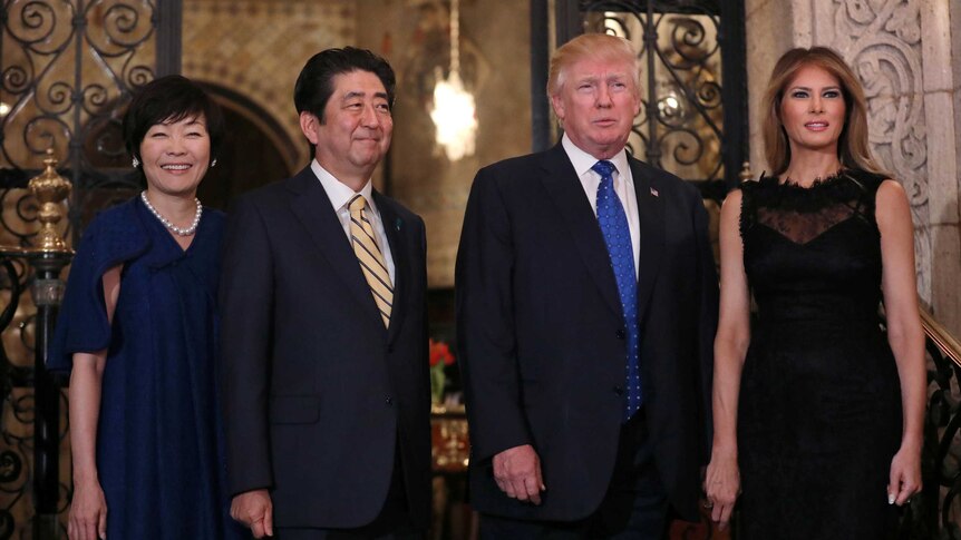 Donald Trump, Melania Trump, Shinzo Abe and Akie Abe pose for a photograph in Florida.