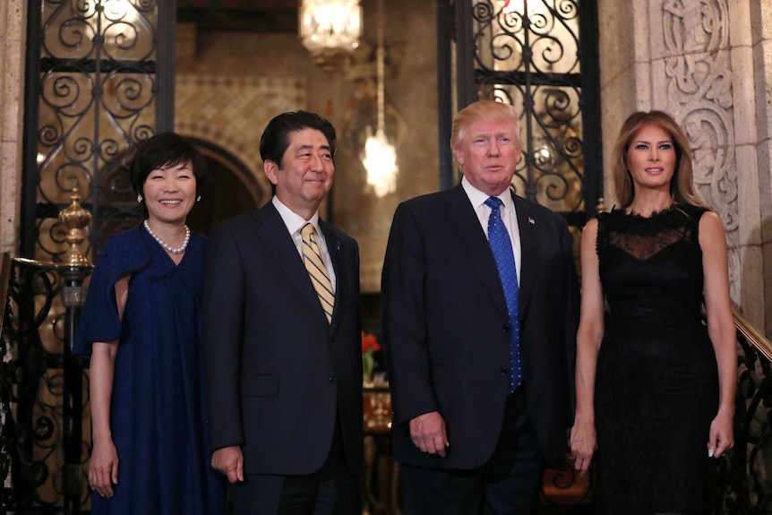 Donald Trump, Melania Trump, Shinzo Abe and Akie Abe pose for a photograph in Florida.