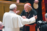Pope Francis is seen reaching out to hug Theodore McCarrick.