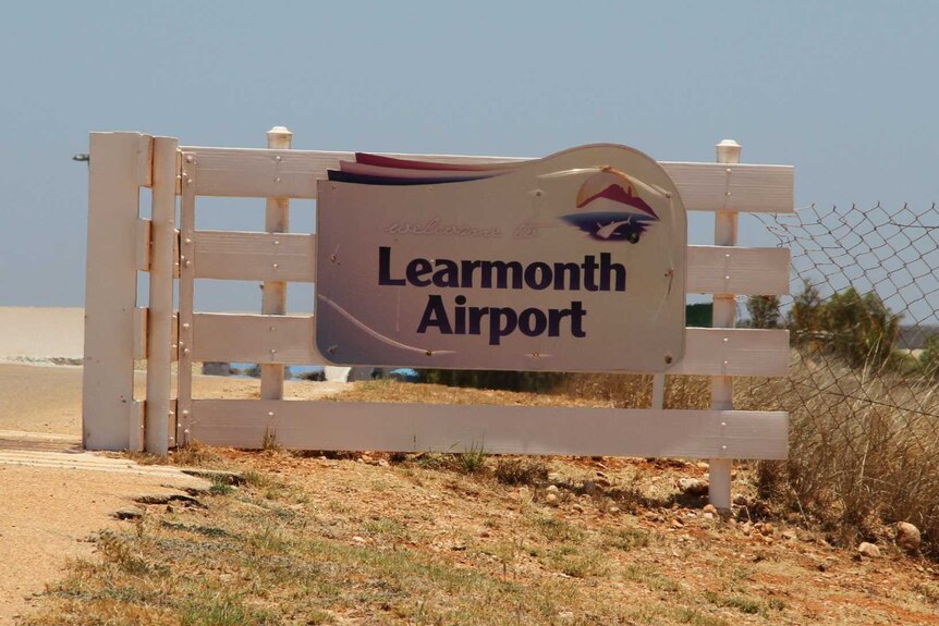 A sign welcoming people to Learmonth Airport