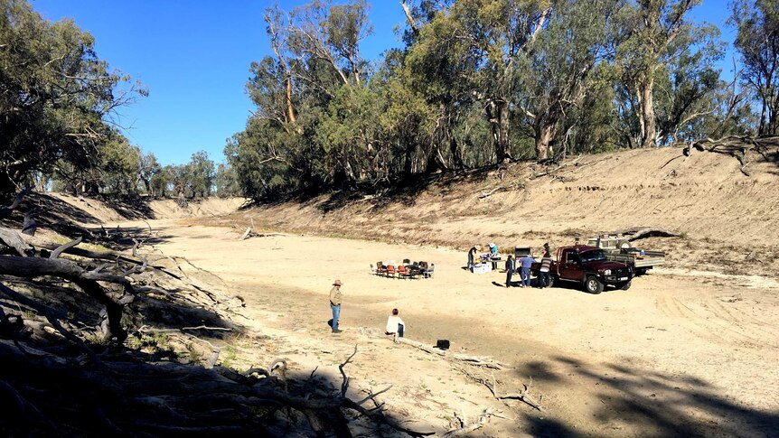 Farmers set up for a BBQ on the bed of the Darling River.