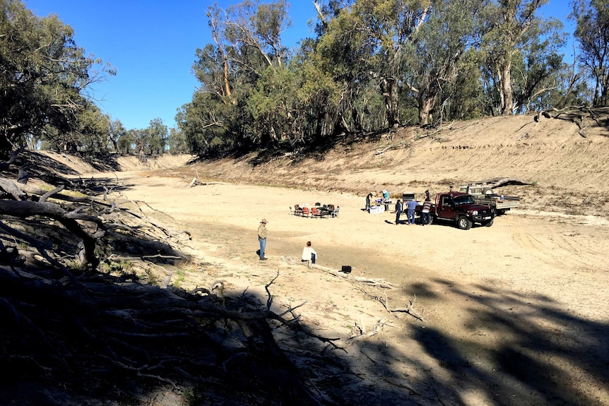 Farmers set up for a BBQ on the bed of the Darling River.