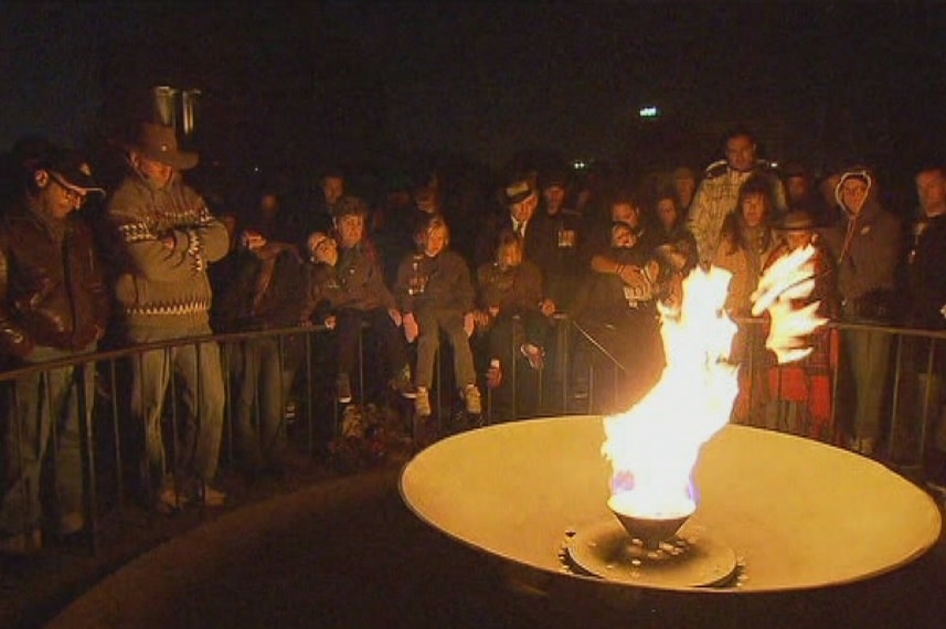 Flame in the dark on Anzac Day in Melbourne