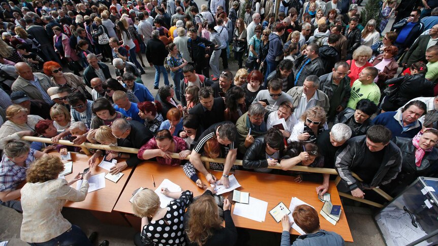 Ukrainians vote during the referendum