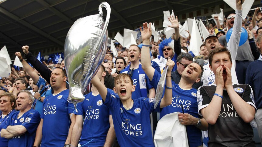 Fans at the King Power Stadium celebrate their team's success