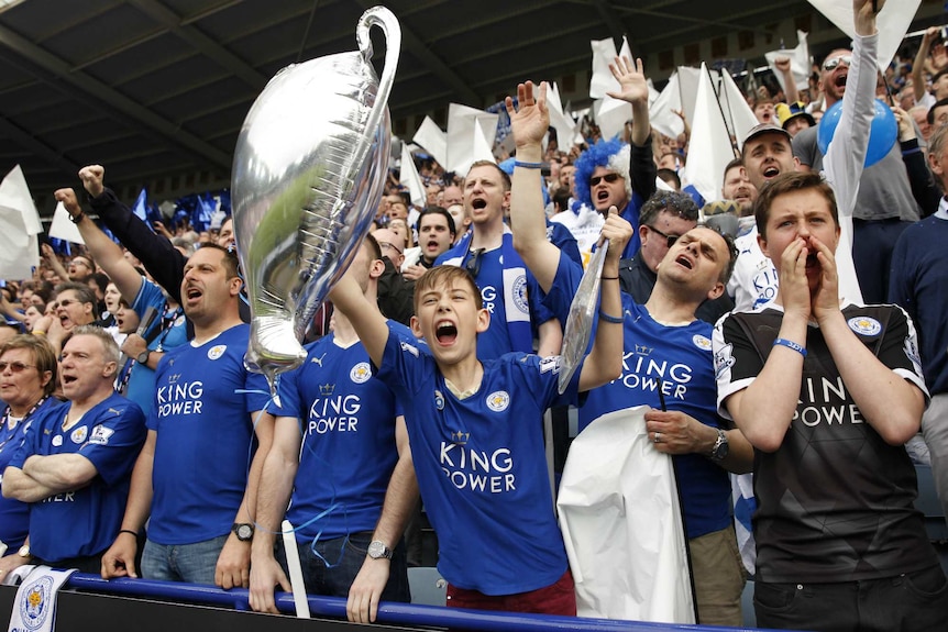 Fans at the King Power Stadium celebrate their team's success