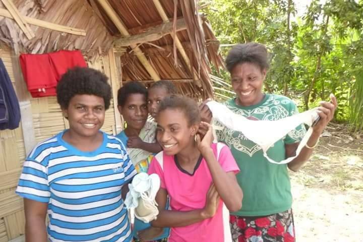 A group of women holding bras in Fiji.