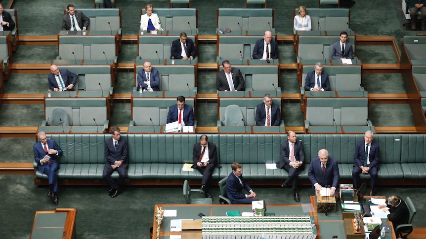 Coalition sit spaced apart.