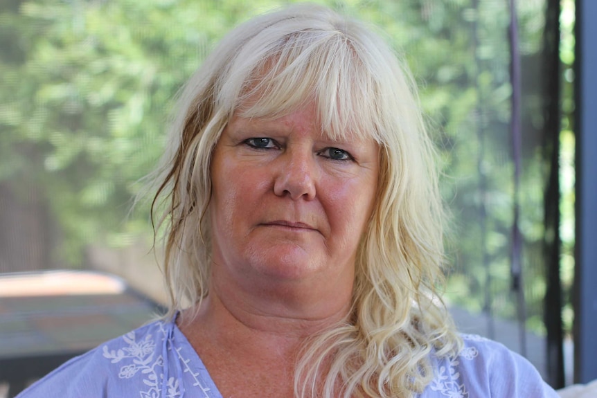 Jane Reynolds sits in front of a window