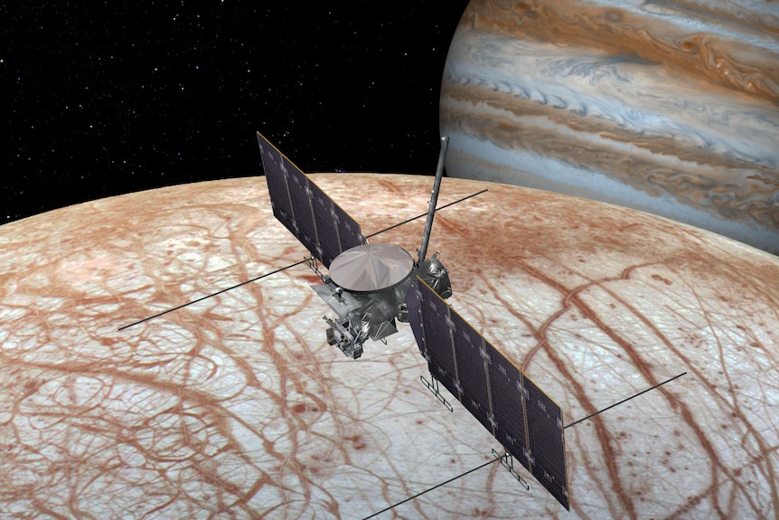 Artist's impression of spacecraft above Europa with Jupiter in background