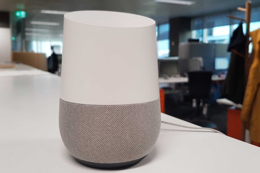 Google Home speaker on desk.