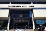 The front entrance of Maroochydore Court House, with a sign indicating so.