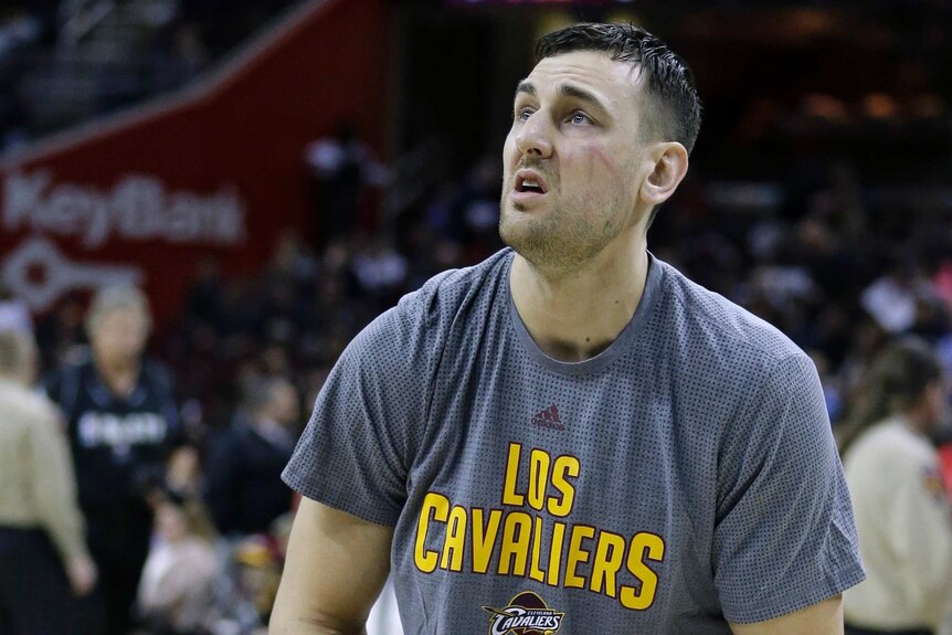 Andrew Bogut warms up for his Cavaliers debut prior to sustaining his leg injury.