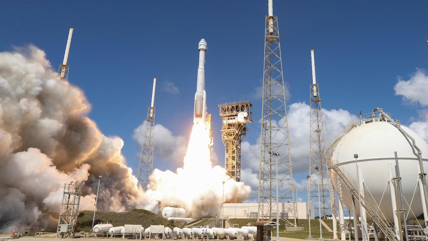A spacecraft is blasting off from a launchpad with loads of smoke underneath