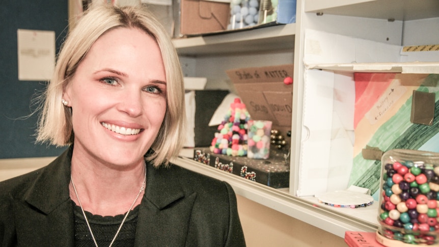 A woman stands in a science classroom at Bulli High School