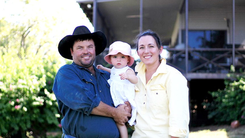 Glen Brooker and Lisa Walter holding their daughter Freya.