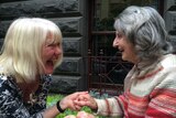 Laughter yoga: Instructor Carolyn Nicholson and new laughter yoga student Aileen Erikson