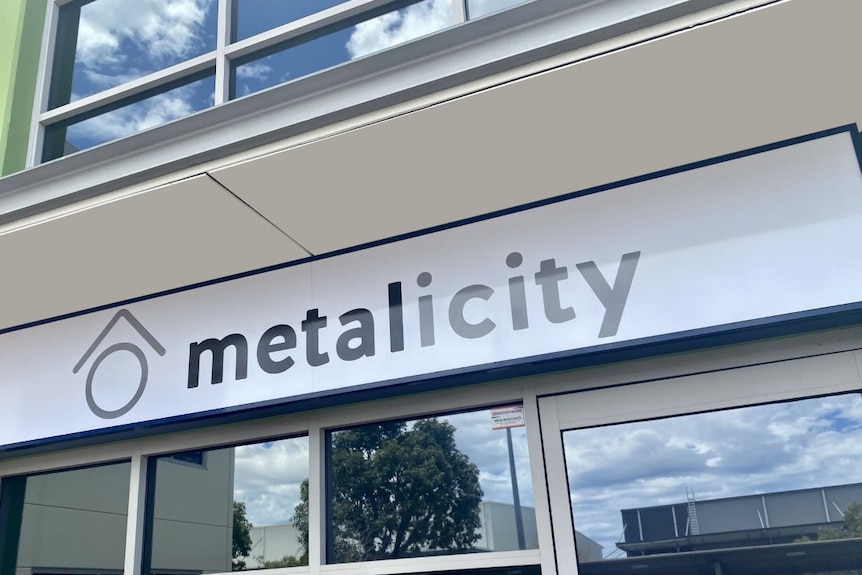 An office sign out the front of the building of gold exploration company Metalicity.  