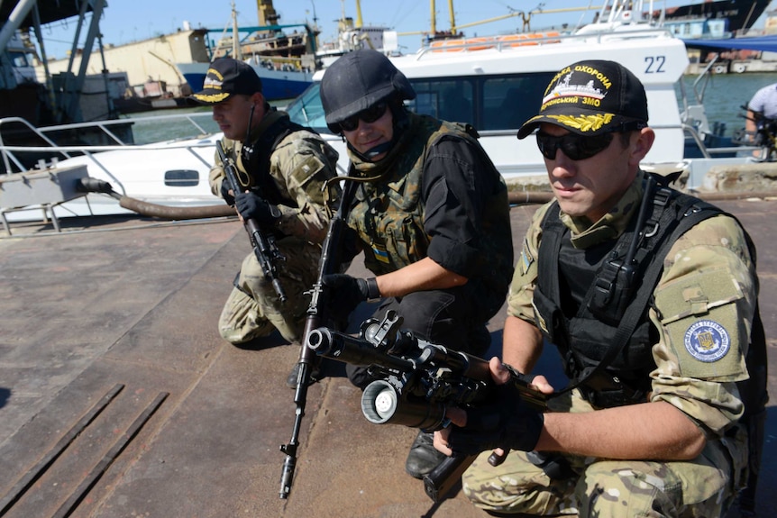 Ukrainian soldiers at a dock on the Azov Sea
