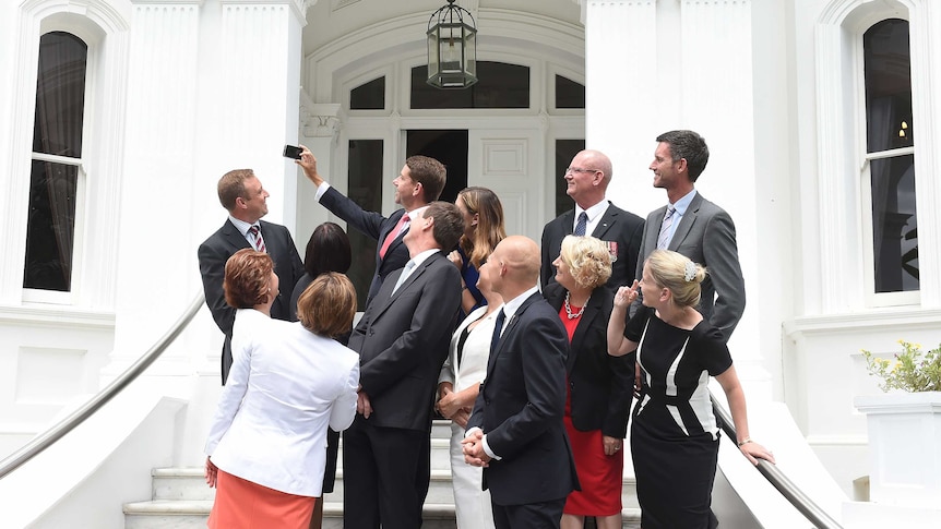 Health Minister Cameron Dick takes a selfie of the new Queensland ministry