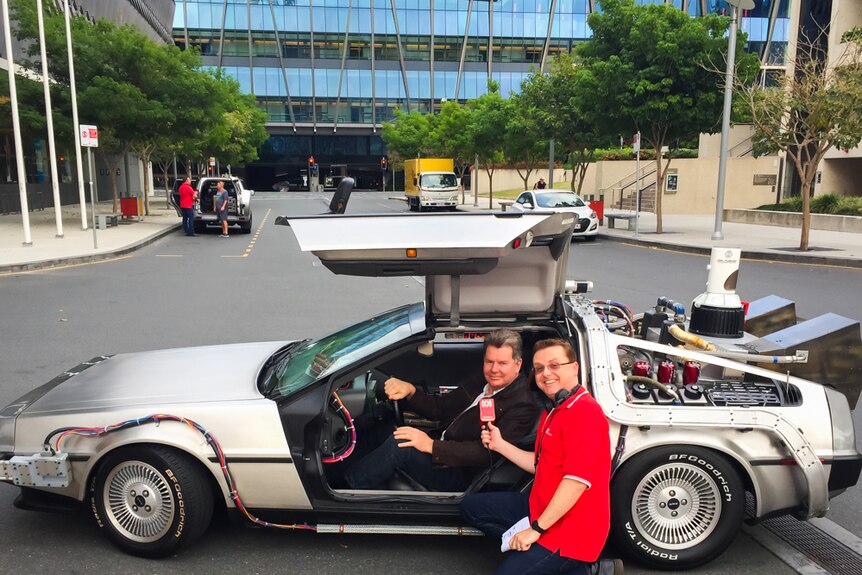 Spencer Howson and Brad Gaffy the owner of the DeLorean Time Machine at South Bank in Brisbane.
