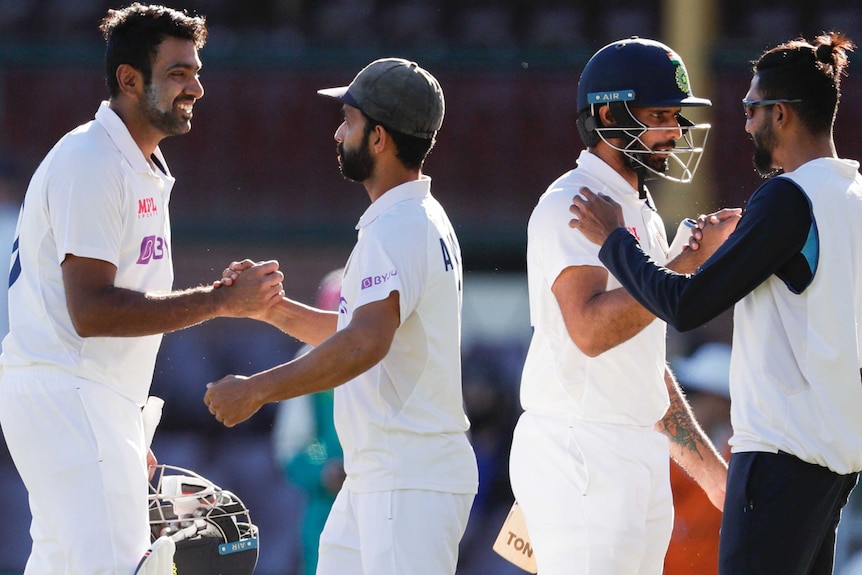 Ravichandran Ashwin shakes hands with Ajunkia Rahane, Hanuma Vihari is congratulared by Mohammed Siraj