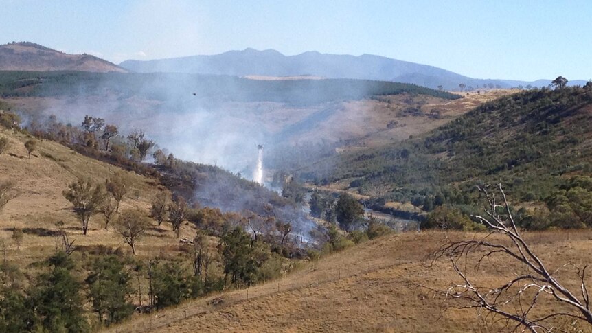 Currently 19 fire units and a water bombing helicopter are on the scene in Canberra's west.