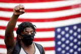 Demonstrator raises his fist at US protest