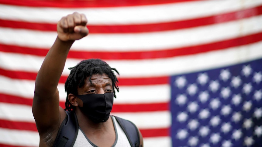 Demonstrator raises his fist at US protest