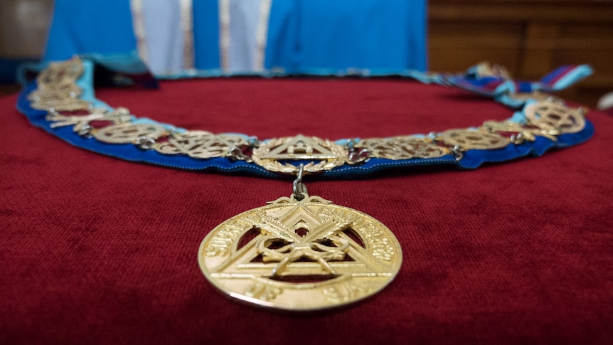 The gown and gold chain collar worn by the Supreme Grand Master in The Glover Room.