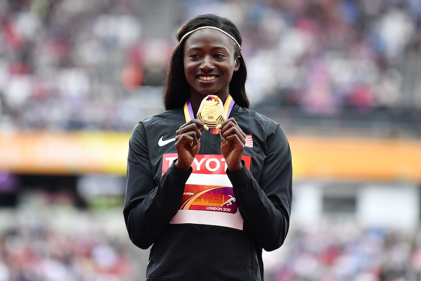Gold medalist Tori Bowie of the United States poses with her medal.