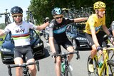 (LtoR) Mark Cavendish, Christopher Froome, and British Bradley Wiggins, ride together in the last stage of the Tour De France.