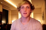 A still from a video of Logan Paul, who is looking into the camera.