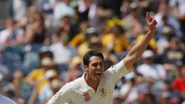 Mitchell Johnson celebrates taking the wicket of Neil McKenzie