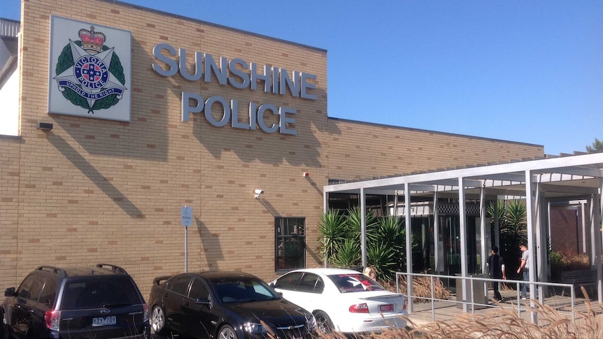 A modern, brick building with the words Sunshine Police Station on the front