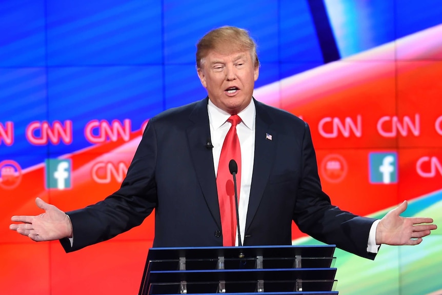 Donald Trump gestures during the fifth Republican presidential debate