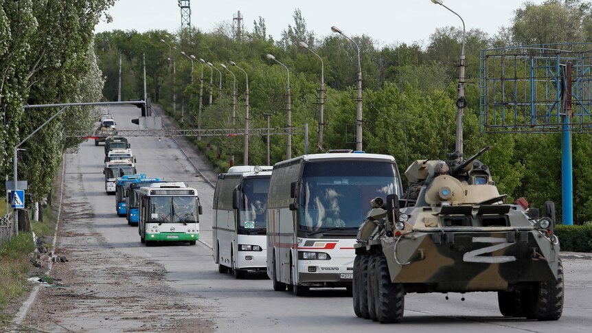 Buses carrying members of Ukranian forces who have surrendered after weeks-long siege in the Azostal steelworks in Mariupol