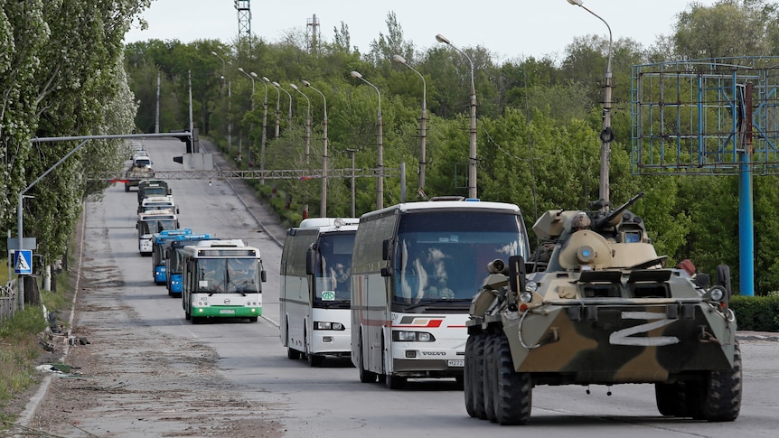 Buses carrying members of Ukranian forces who have surrendered after weeks-long siege in the Azostal steelworks in Mariupol