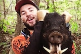 A photo from Jack O'Connor's Instagram account of him holding a dead boar.