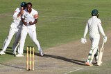 Kasigo Rabada celebrates after taking the wicket of Australia's Usman Khawaja