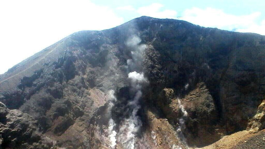 An image shows smoke rising from inside the volcano.