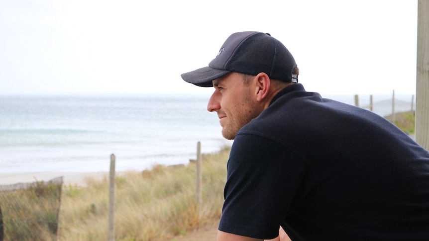 Luke Thorpe watches out over the sea from his home.