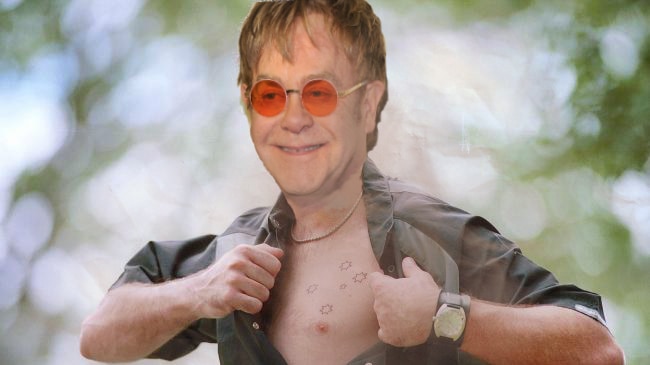 Elton John with a southern cross tattoo