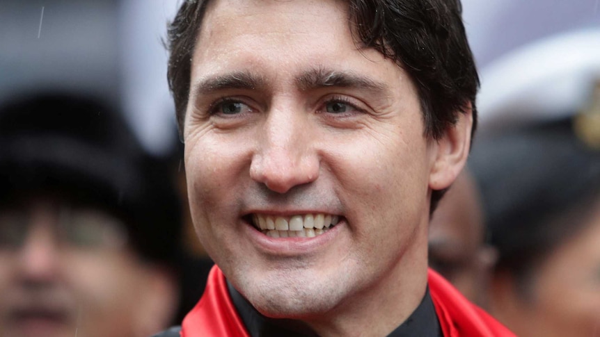 Canada's Prime Minister Justin Trudeau waves to the crowd at a Chinese New Year parade in Vancouver, BC, Canada January 29, 2017. 