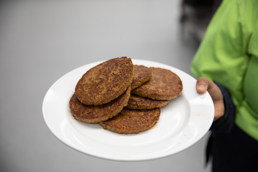 A plate of plant-based burger patties.